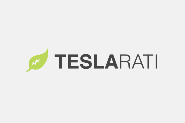 Logo of TeslaRati, featuring the text 'TESLARATI' in bold gray letters accompanied by a green leaf design with a lightning bolt symbol.