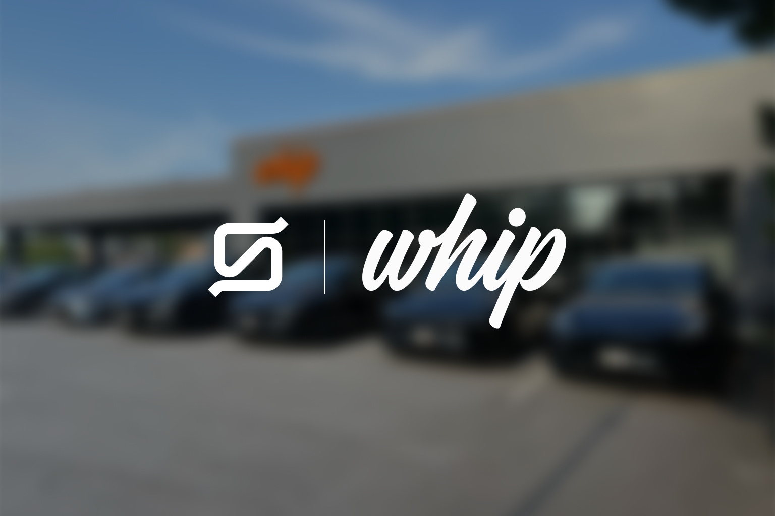 A blurred background shows a row of cars parked in front of a building. In the foreground, the logo of "whip" is displayed prominently in a white font.