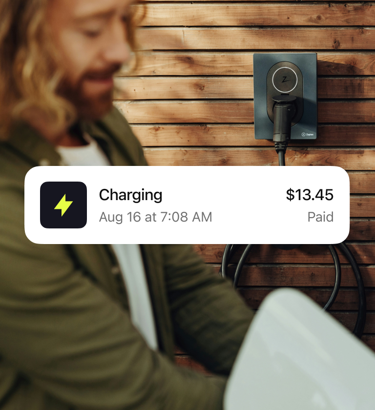 EV payment UI overlayed on image of man charging vehicle