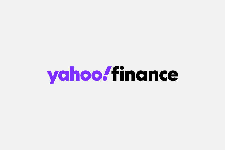 Logo of Yahoo Finance featuring the word 'yahoo!' in purple and 'finance' in black on a light gray background.